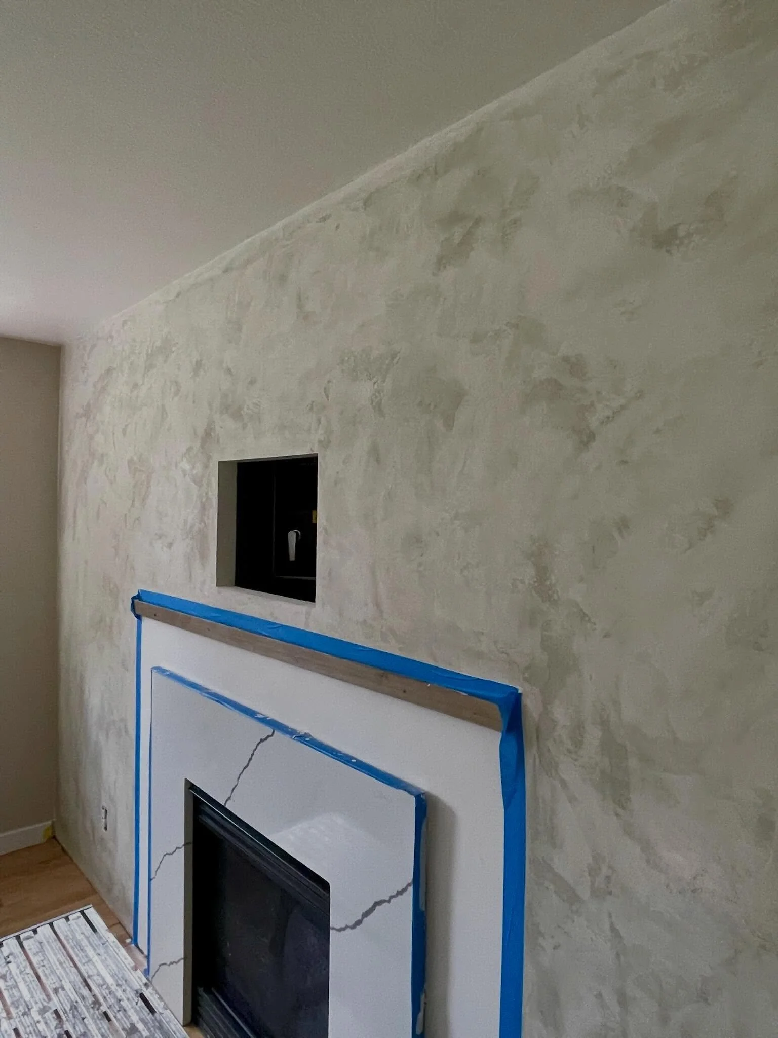 Freshly waxed and full of character. No two Tadelakt surfaces are ever the same&mdash;the subtle variations, soft movement, and handcrafted texture make this dining room fireplace a truly one-of-a-kind feature.
