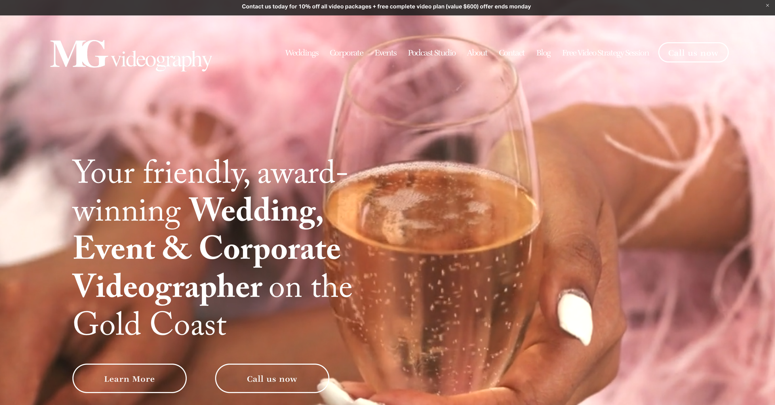 Website banner for MG Videography featuring a hand holding a glass of champagne with text promoting wedding, event, and corporate videography services on the Gold Coast.