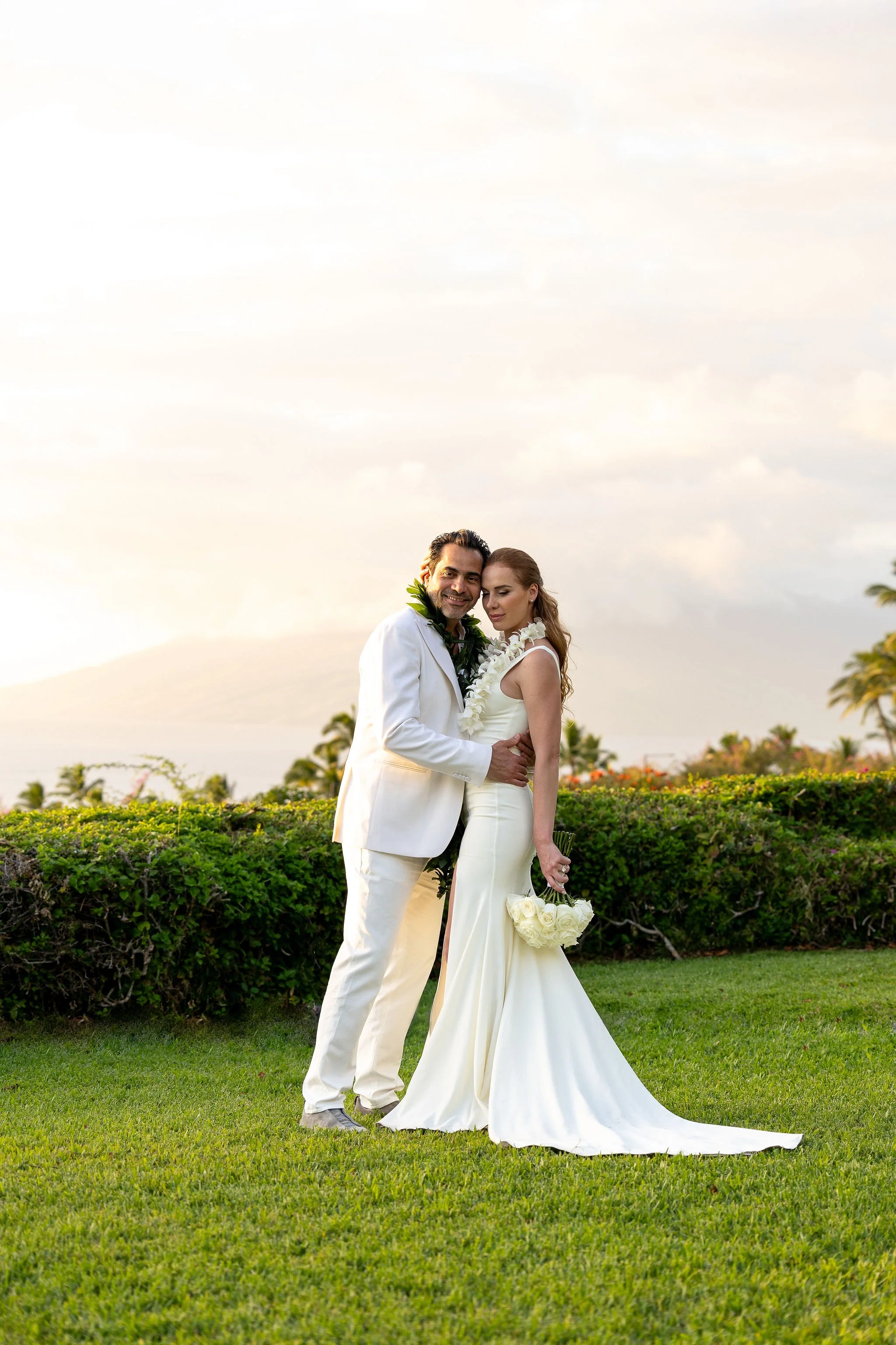 Hotel Wailea Wedding Photography by Lesley Castle Photo with bride and groom and all white classic wedding fashion.