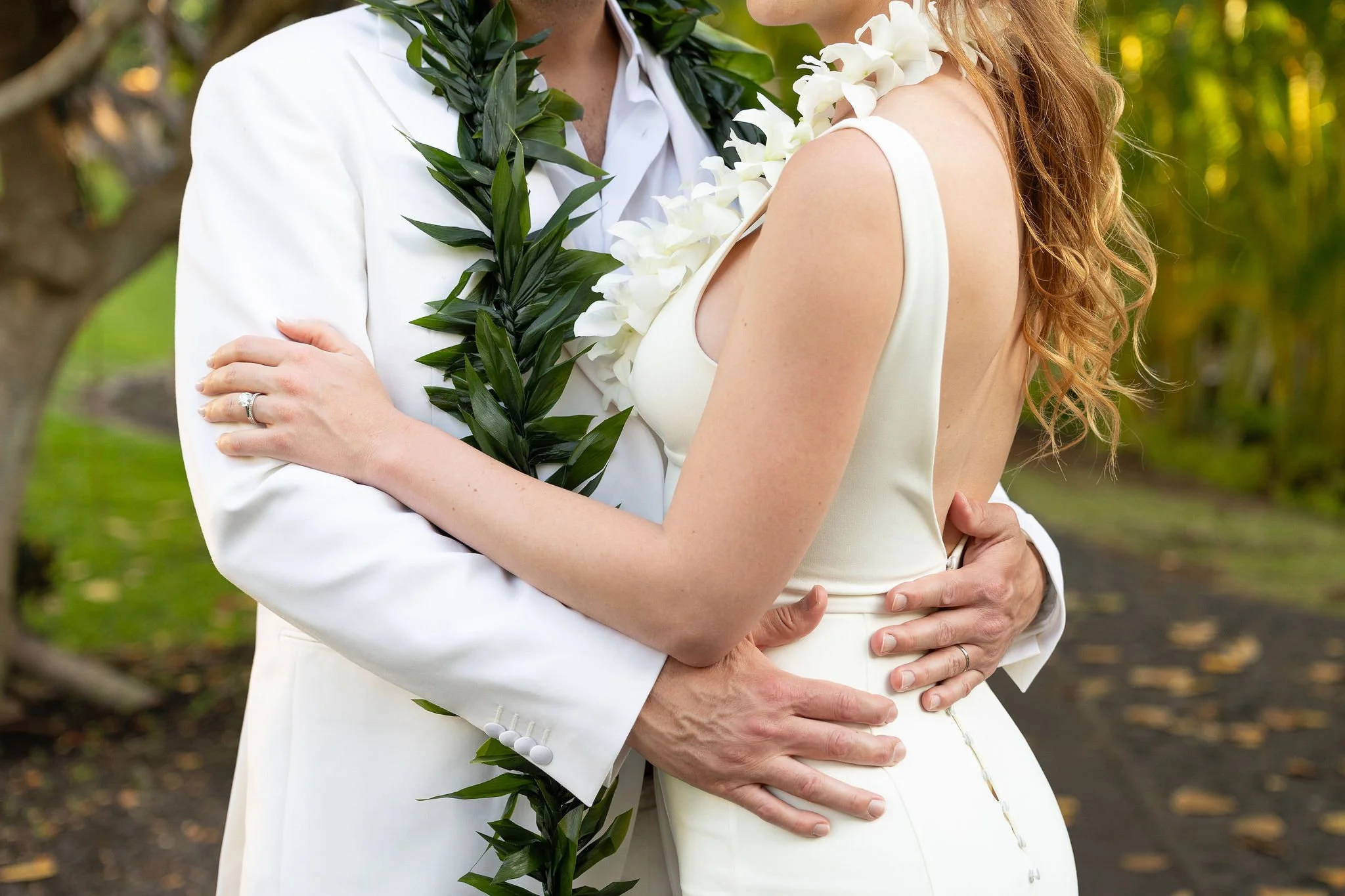 Hawaiian tropical leis for bride and groom at Hotel Wailea in Maui, Hawaii for classic and modern wedding photography.