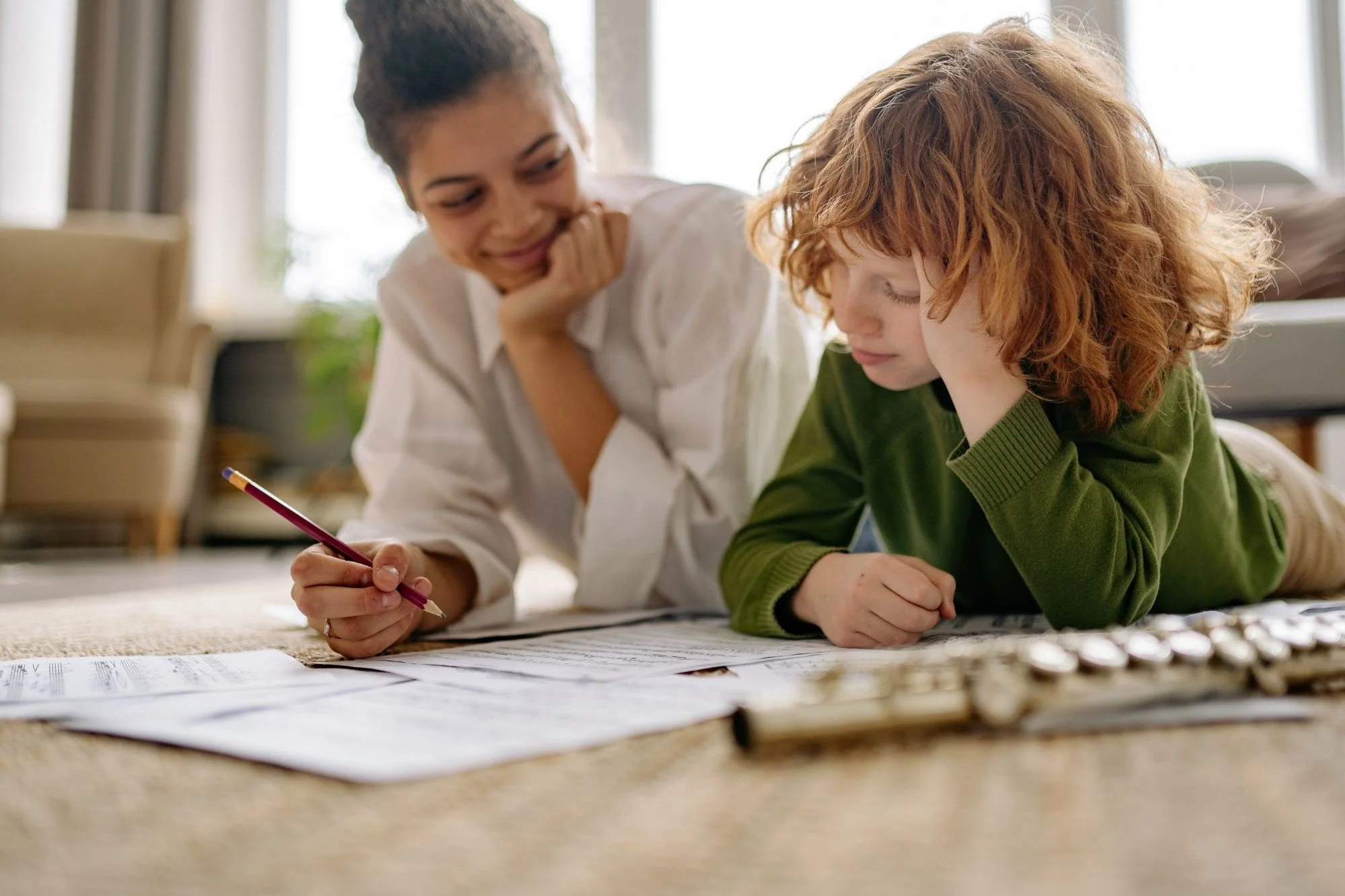 mom and son lying on family friendly carpet