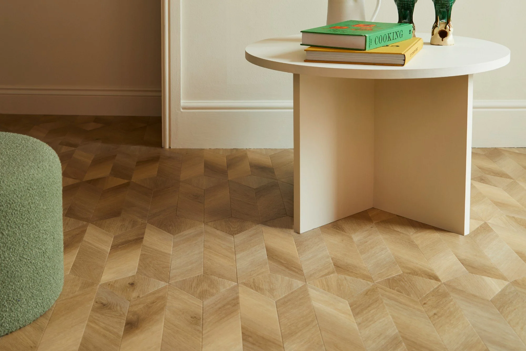 Children's bedroom with pastel furniture and herringbone wood flooring