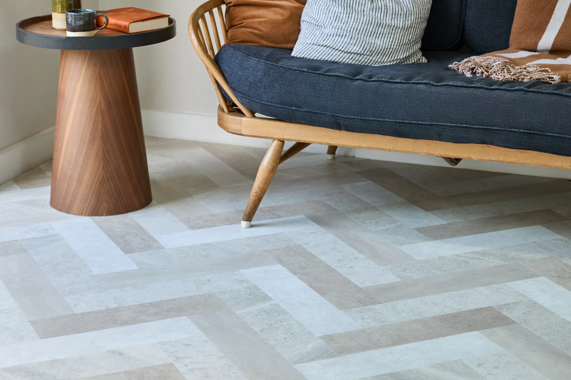 Entryway with checkered flooring and wooden furniture.