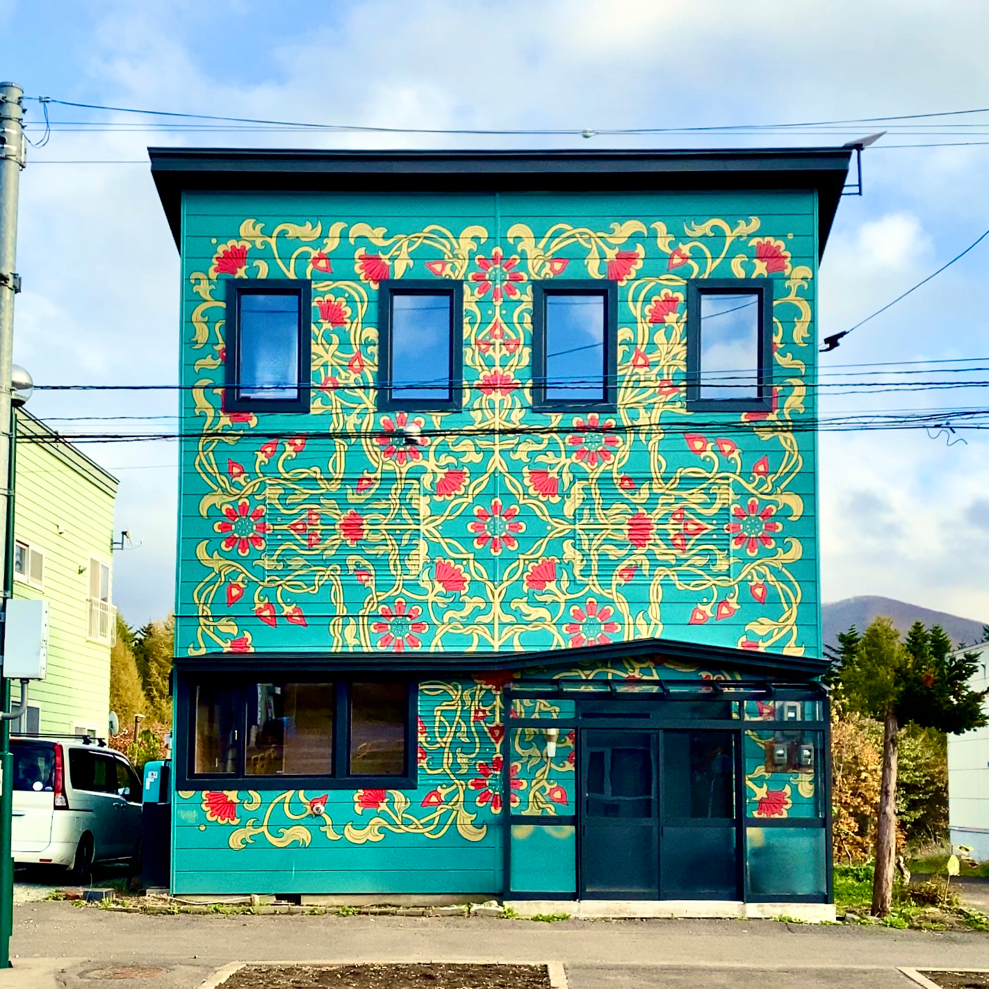 Giant mural painted on the front of a property in Japan by Elizabeth. It made the British Vogue publication in 2024