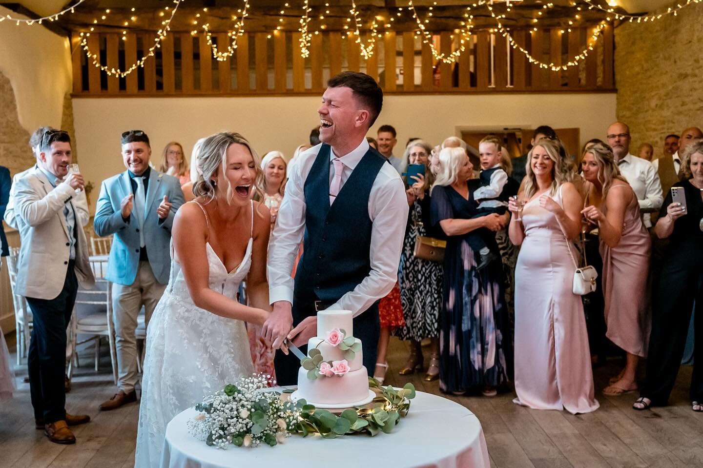 Not everyone finds cutting the cake so hilarious but Sam and @leighireland25 did! Enjoying the moment in the Upper Barn just before the first dance. 

📸 @ianjefferyphotography