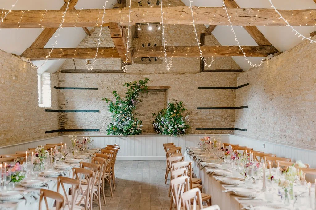 How can we not love this table d&eacute;cor? 🌸

Long tables work so beautifully in our barn, bringing everyone together and giving the space a warm, inviting feel.

Stone walls, wooden beams and soft natural light create an effortless setting for ta