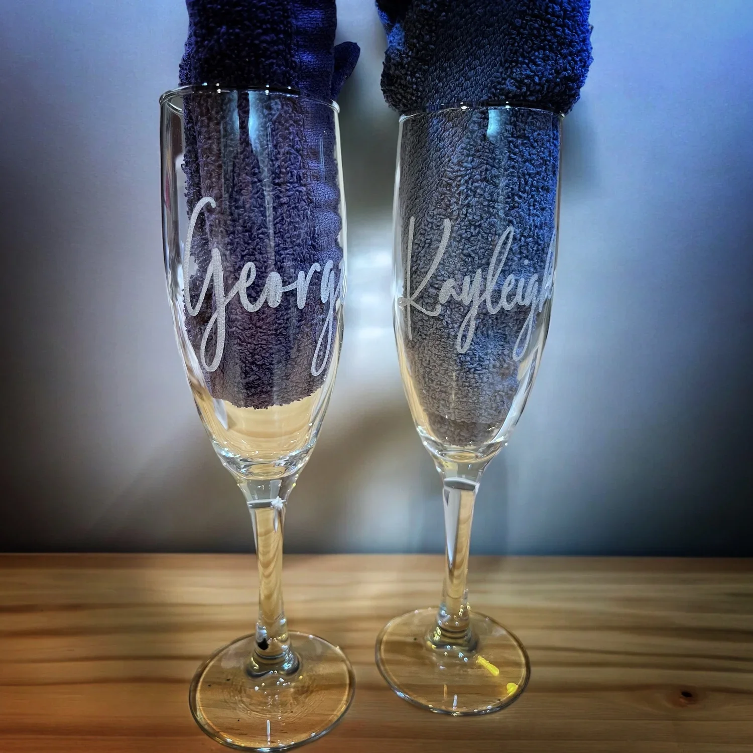 Two engraved champagne glasses
