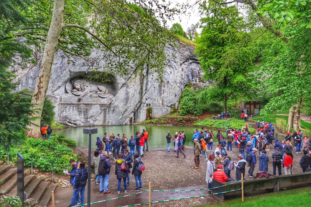 People enjoying the Lion Monument in Luzern, Switzerland.