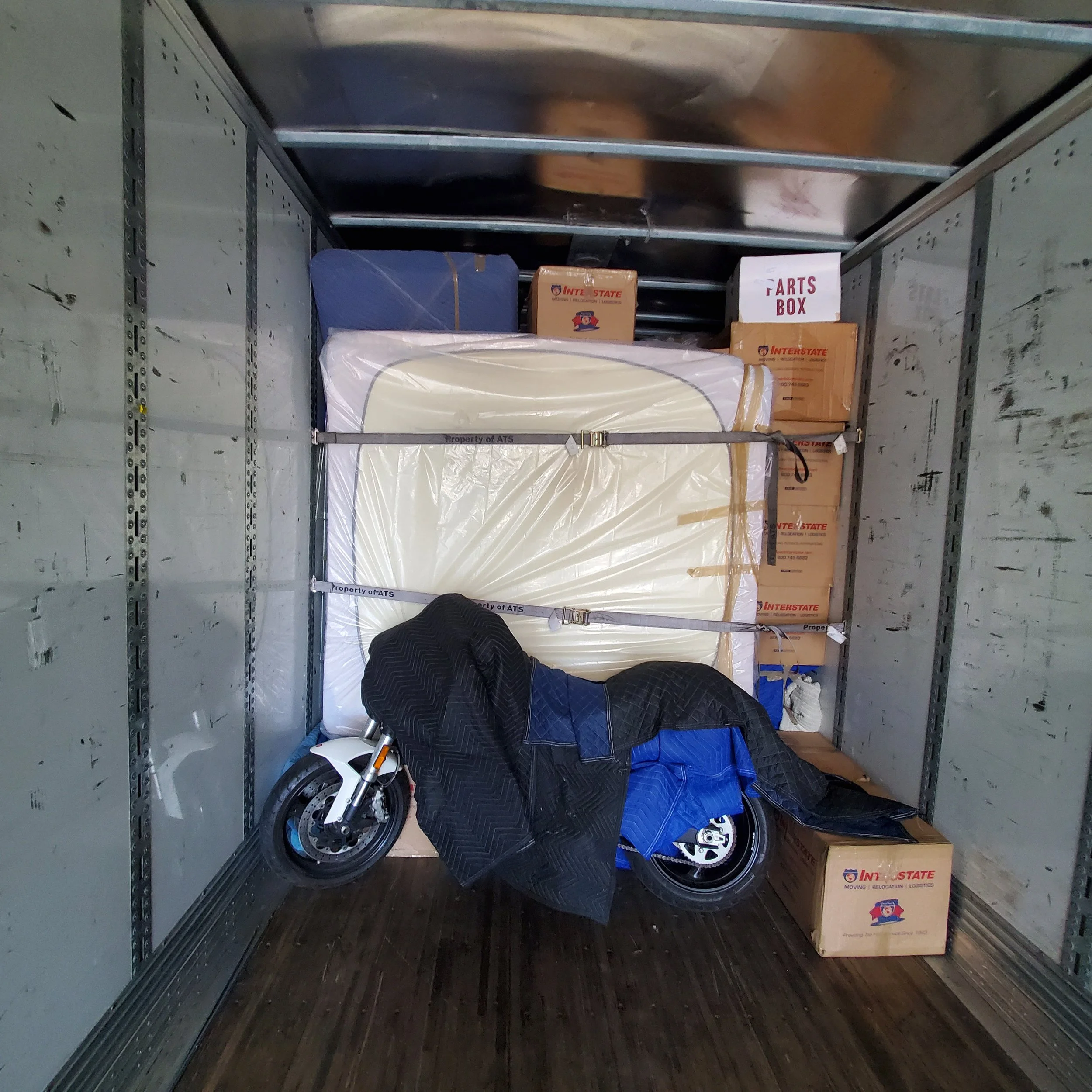 Trailer that has been loaded, including a motorcycle