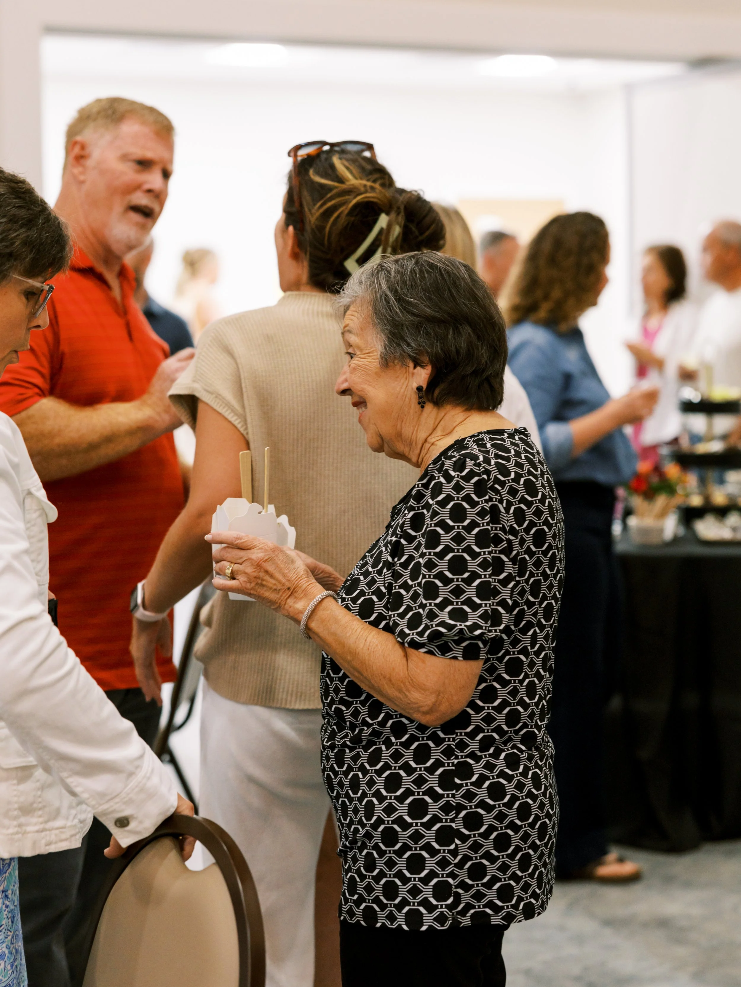 Des Moines event venue filled with smiles, conversation, and community—ideal for weddings, corporate events, and social gatherings in Central Iowa.