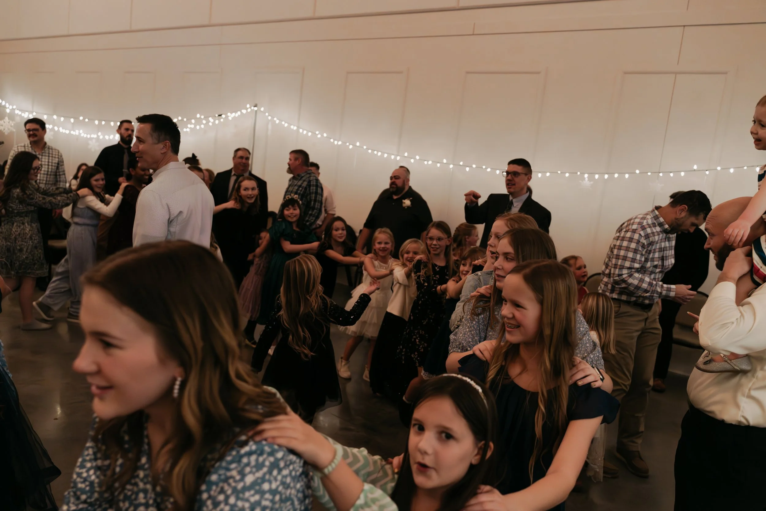 Daddy-Daughter Dance at a Des Moines event venue with indoor lighting and spacious design—fathers and daughters celebrating together in a joyful, family-friendly atmosphere perfect for nonprofit and community events in Central Iowa.