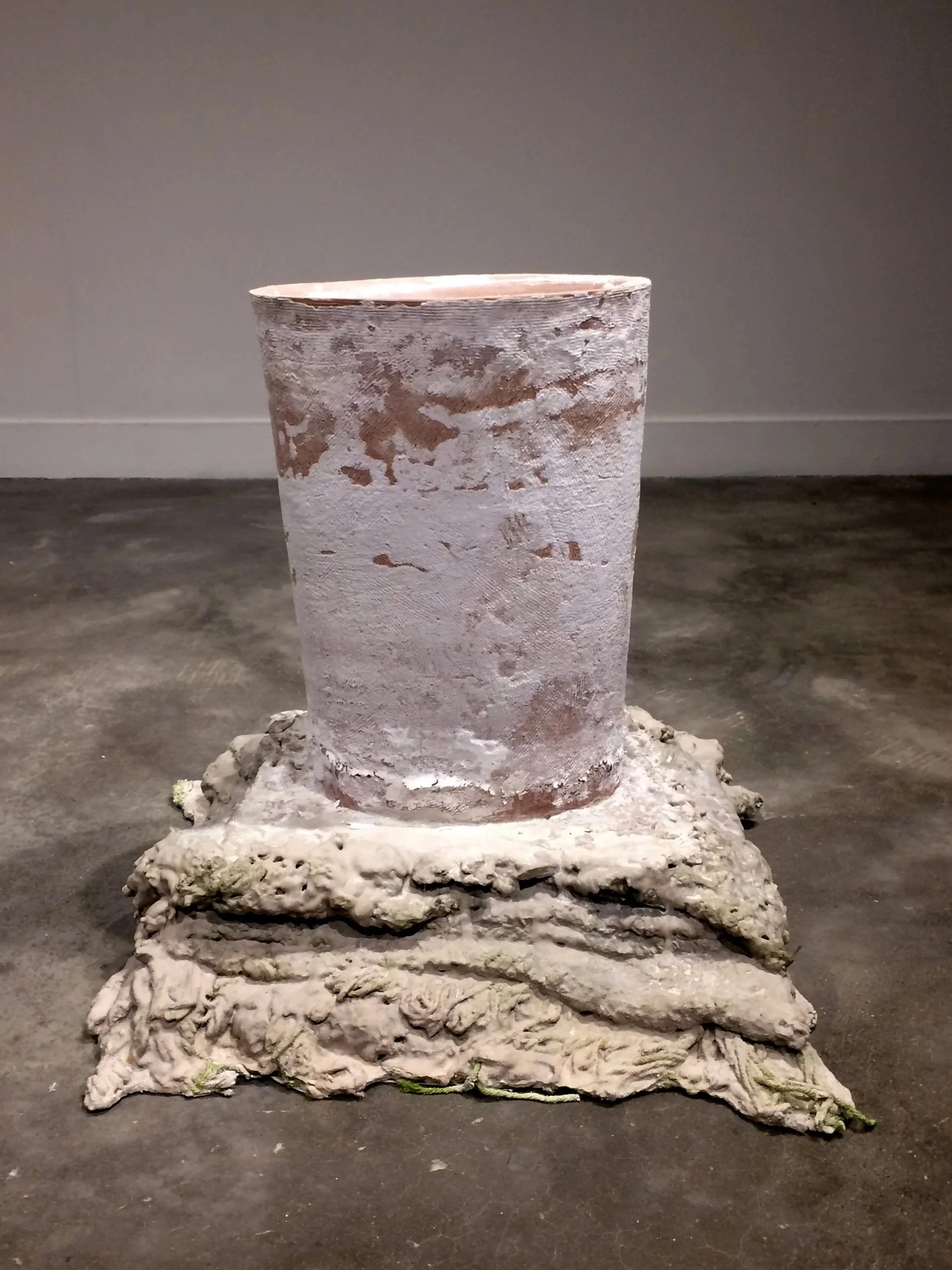 Skin & Stones / Terra cotta, ultracal, afghan squares, ocean water, salt.