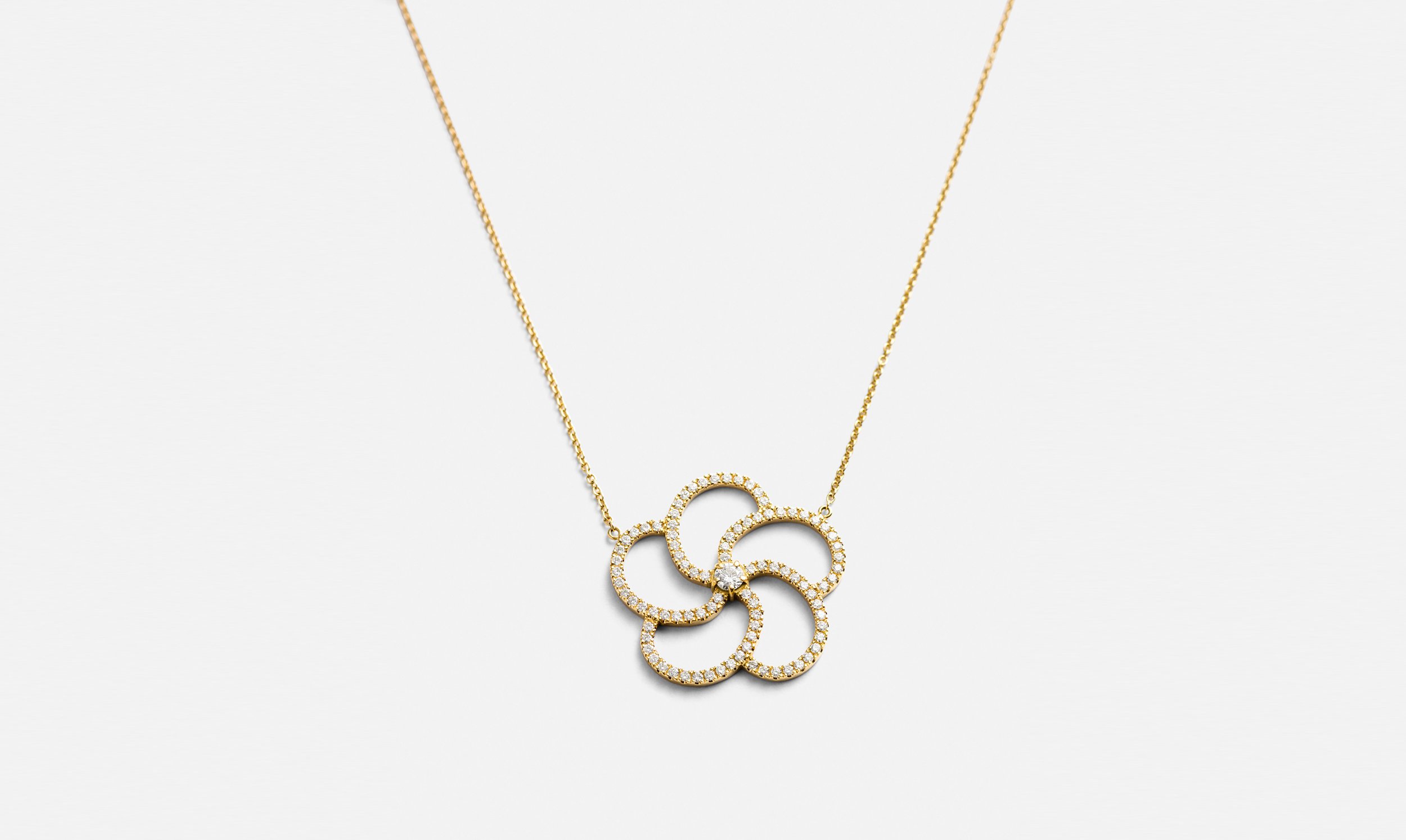 gold-diamond-flower-pendant-on-gold-chain.jpg