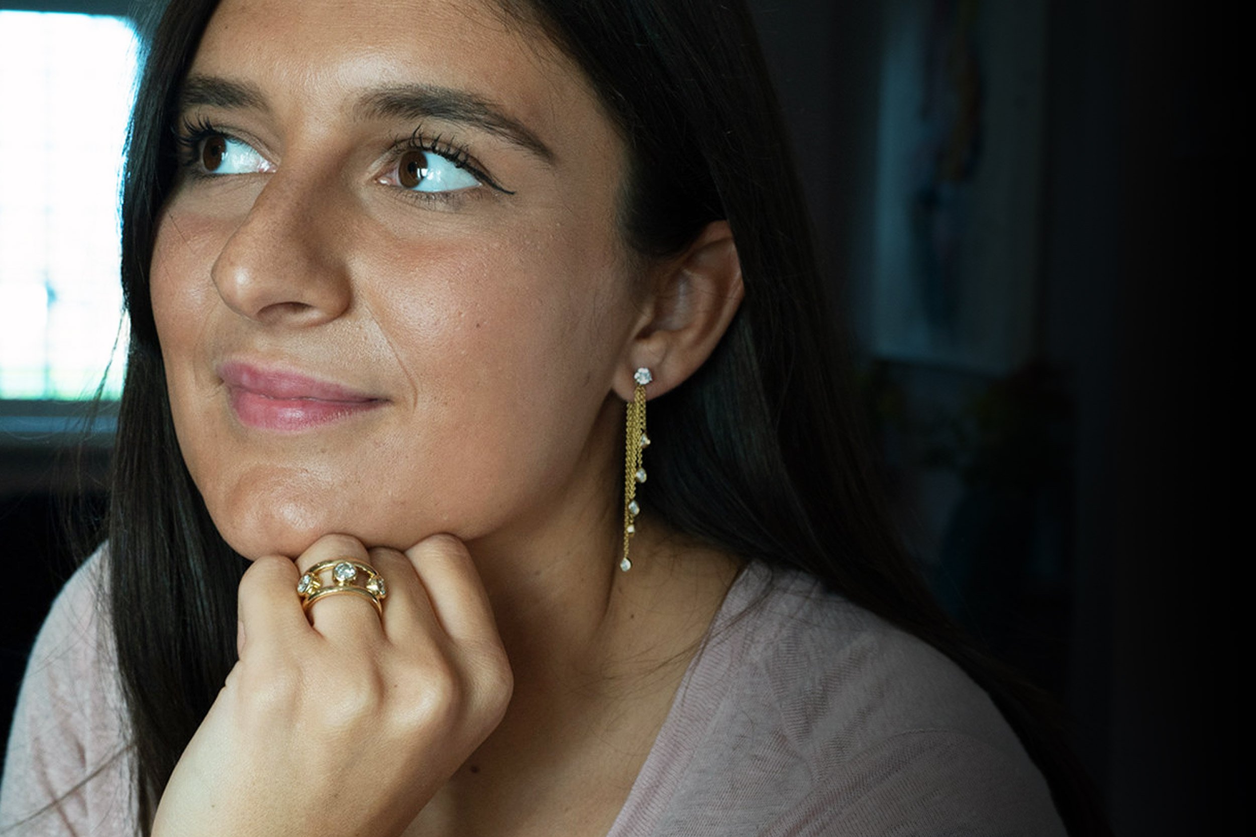 white-female-waering-gold-ring-and-drop-earring.jpg