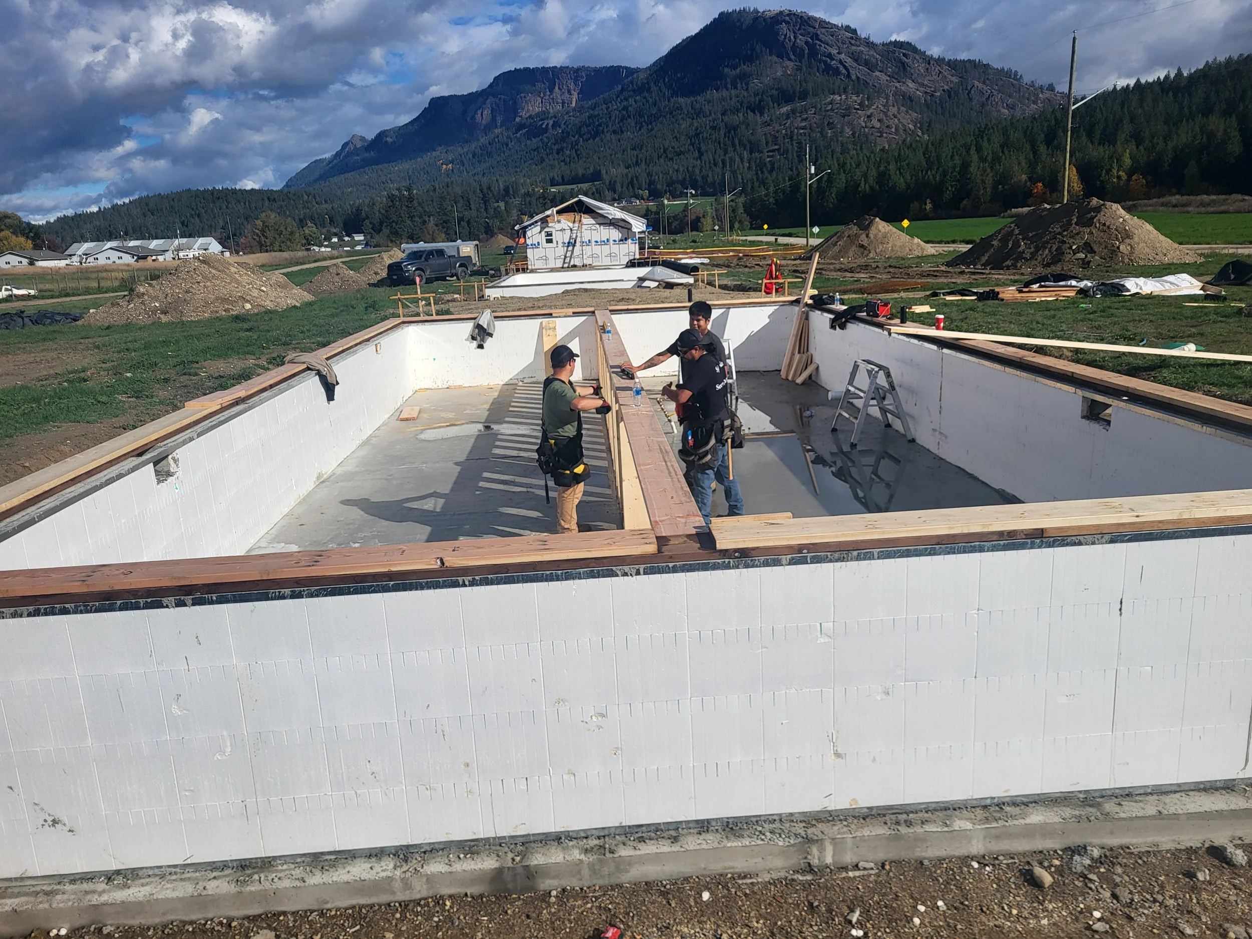 The Splatsin Homes' team laying residential house foundations.