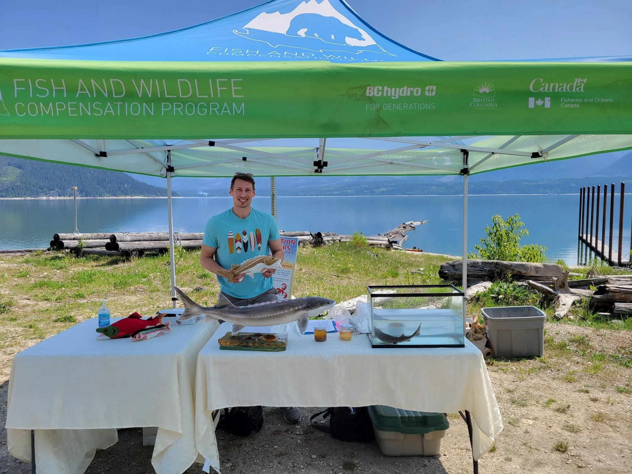 Fisheries Biologist Kyle supporting FWCP outreach teaching groups of school kids, including Shihiya Cultural School, at the Sturgeon release at Shelter Bay.