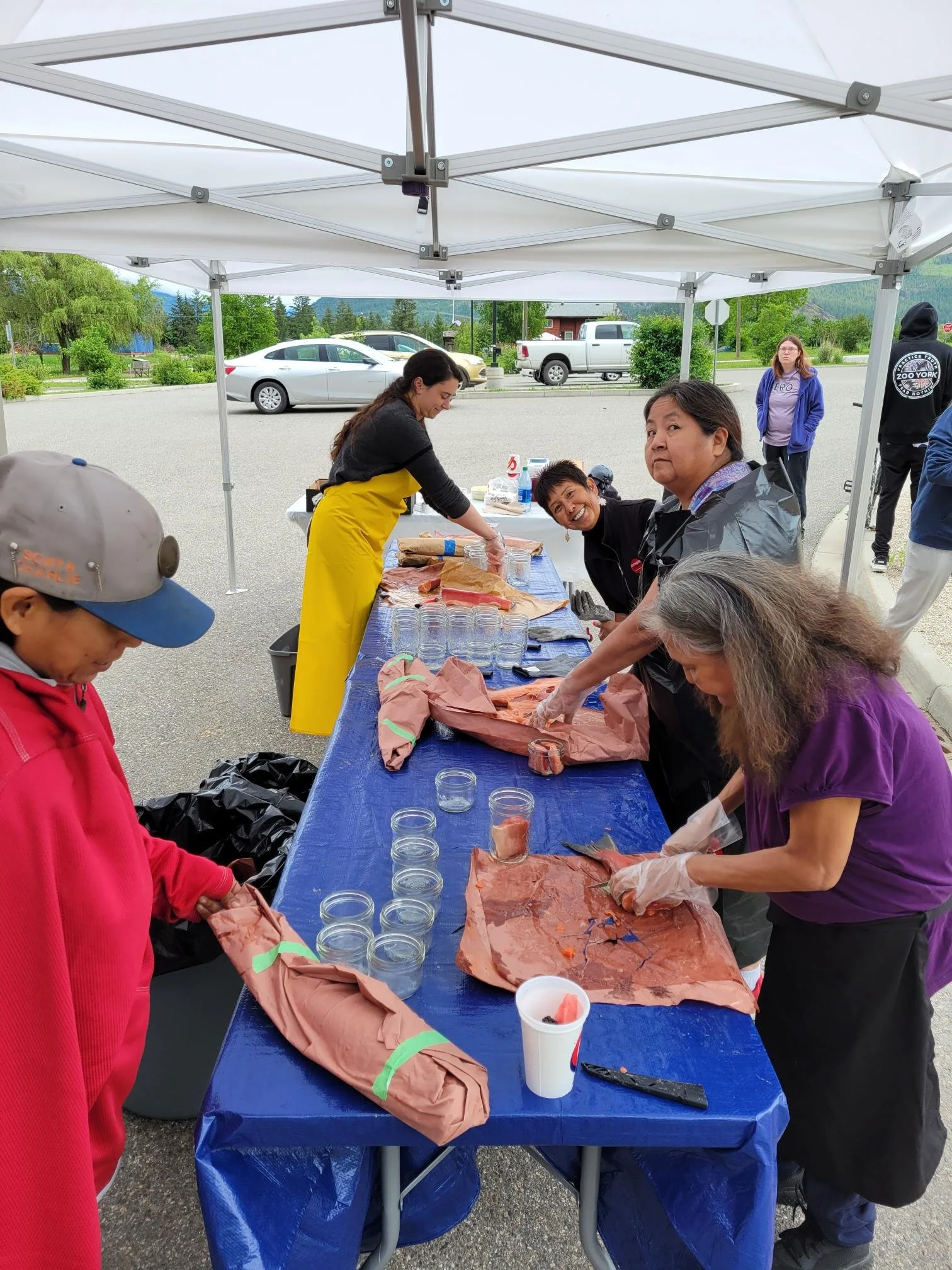 Splatsin processes annual harvests as a community — sharing skills, stories, and laughs.