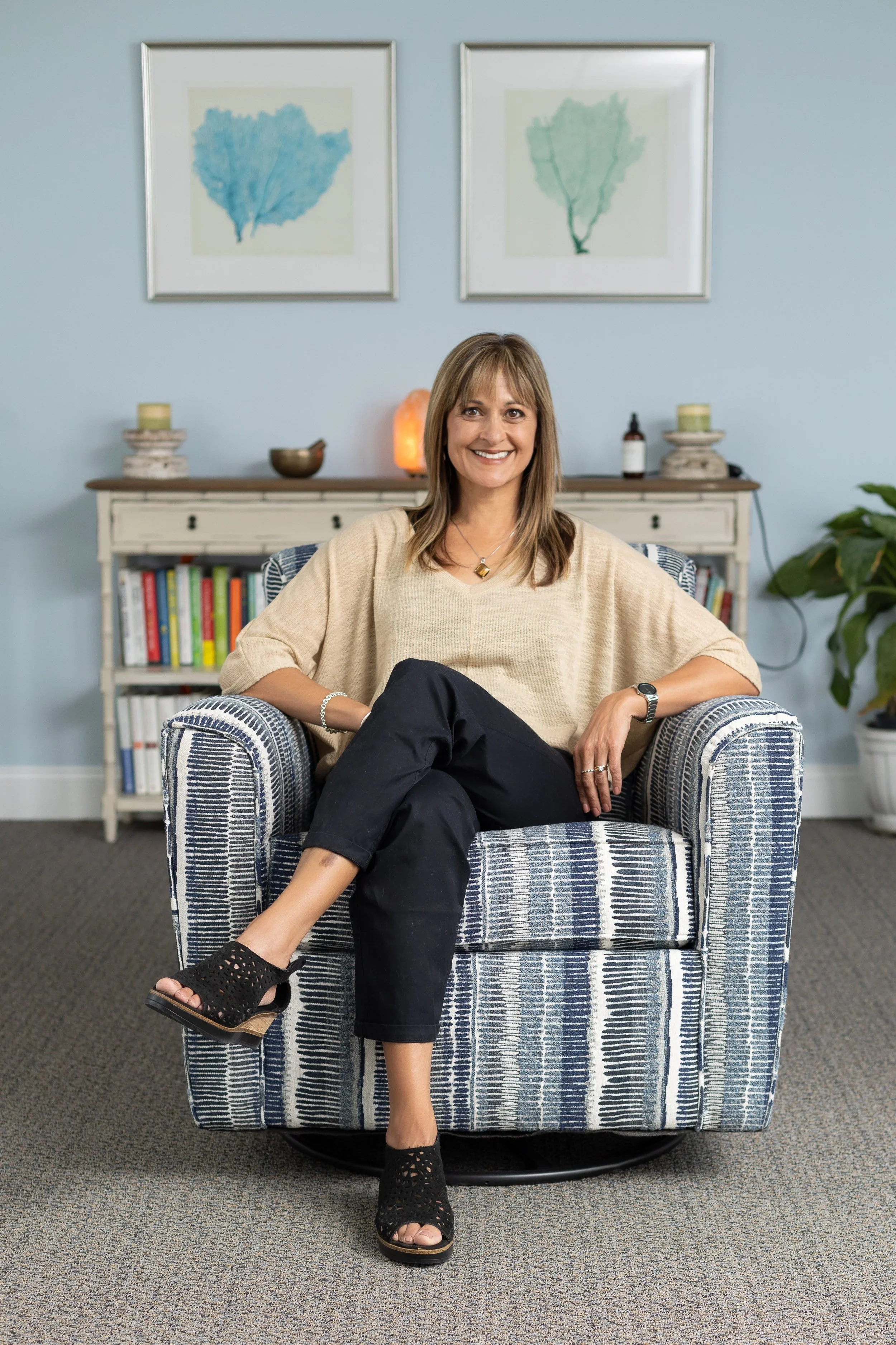 Jennifer Clearwaters in a bright, welcoming setting, counselor and wellness educator portrait.