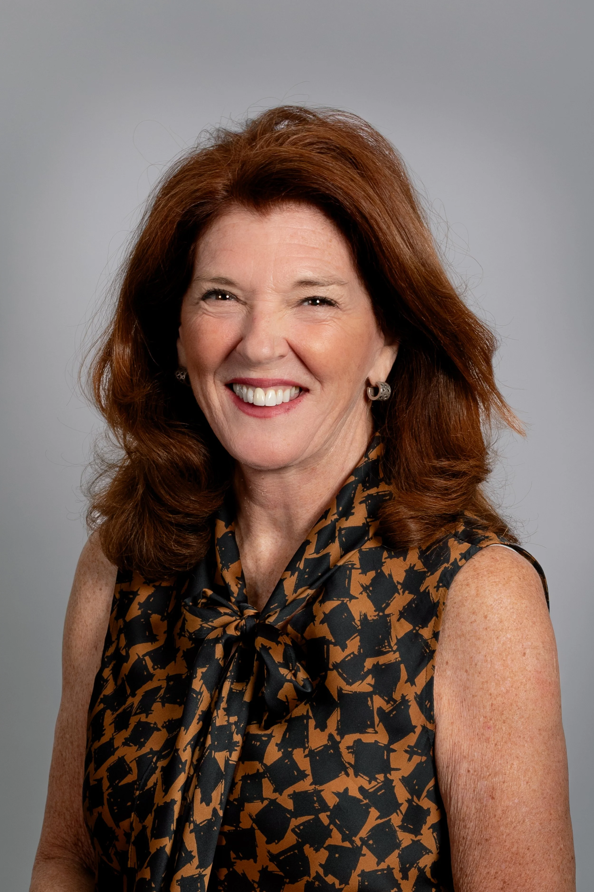 Susan Tellone professional headshot in natural light, educator and suicide prevention specialist.