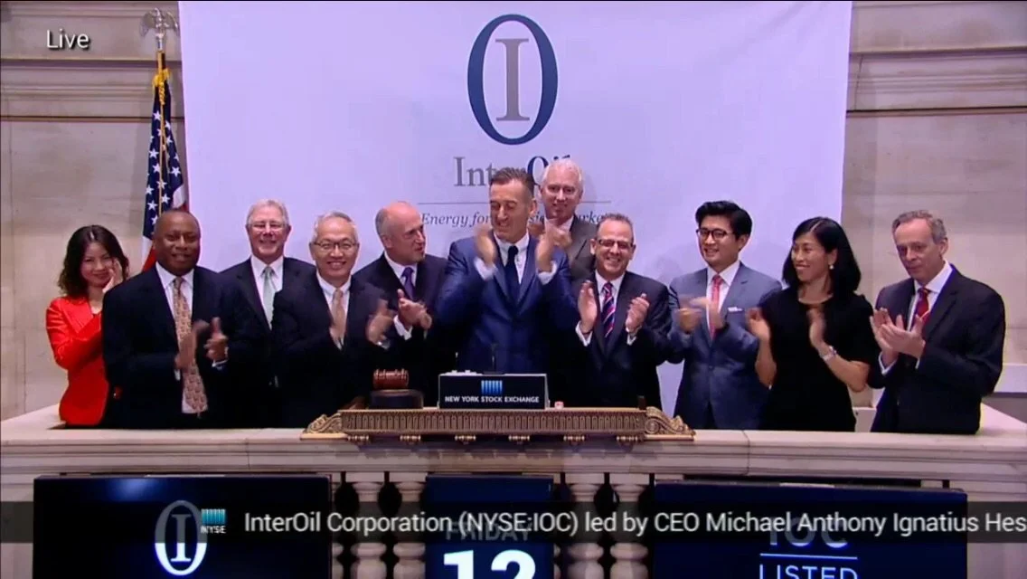 InterOil Ma nagemnt on NYSE podium clapping.JPG
