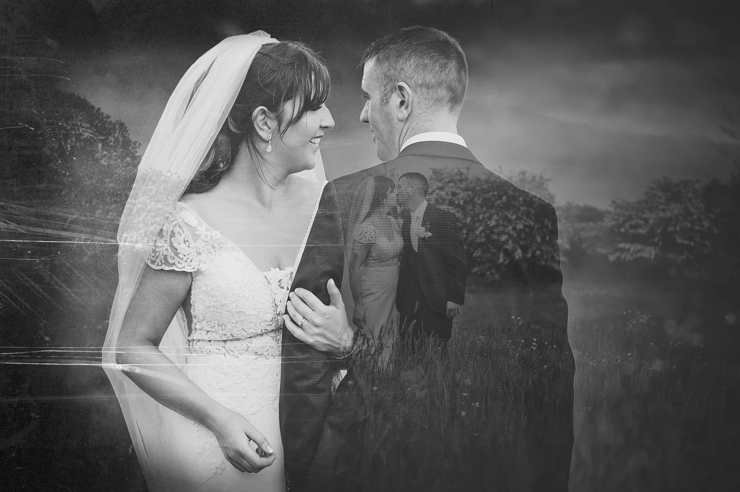 this bride and groom embrace and smile in this double exposure photo