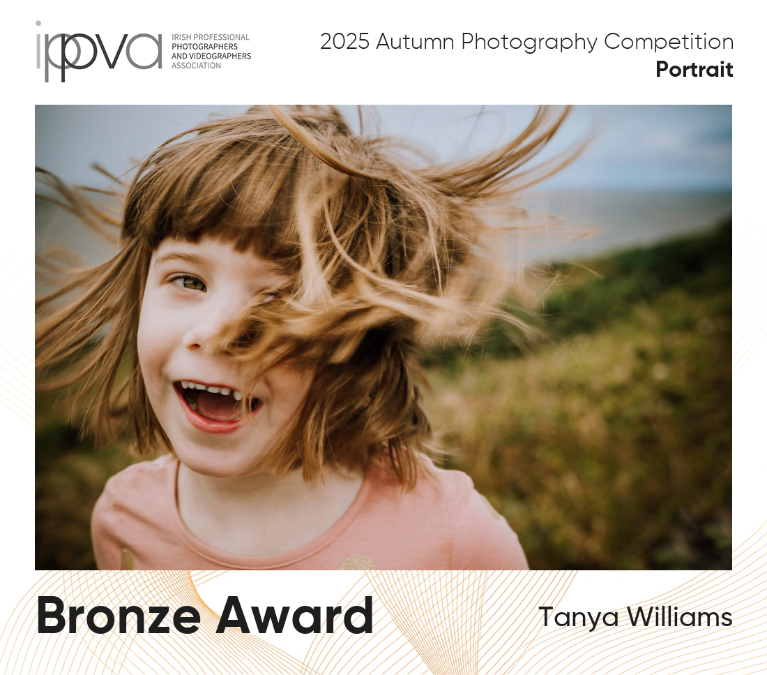Award winning portrait photography of a girl with her hair blowing in the wind.