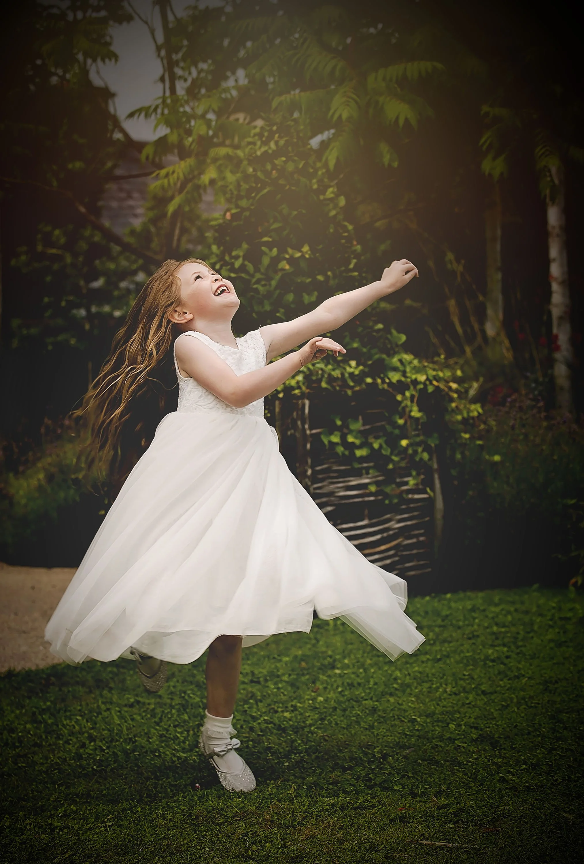 flower girl spins and dances under the sunlight at the Jackie Clark museum in Ballina