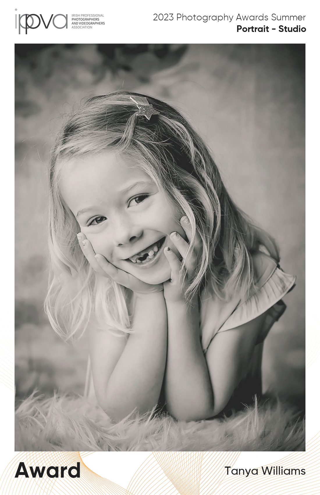 Award winning portrait of a little girl posing and missing her 1st front teeth.