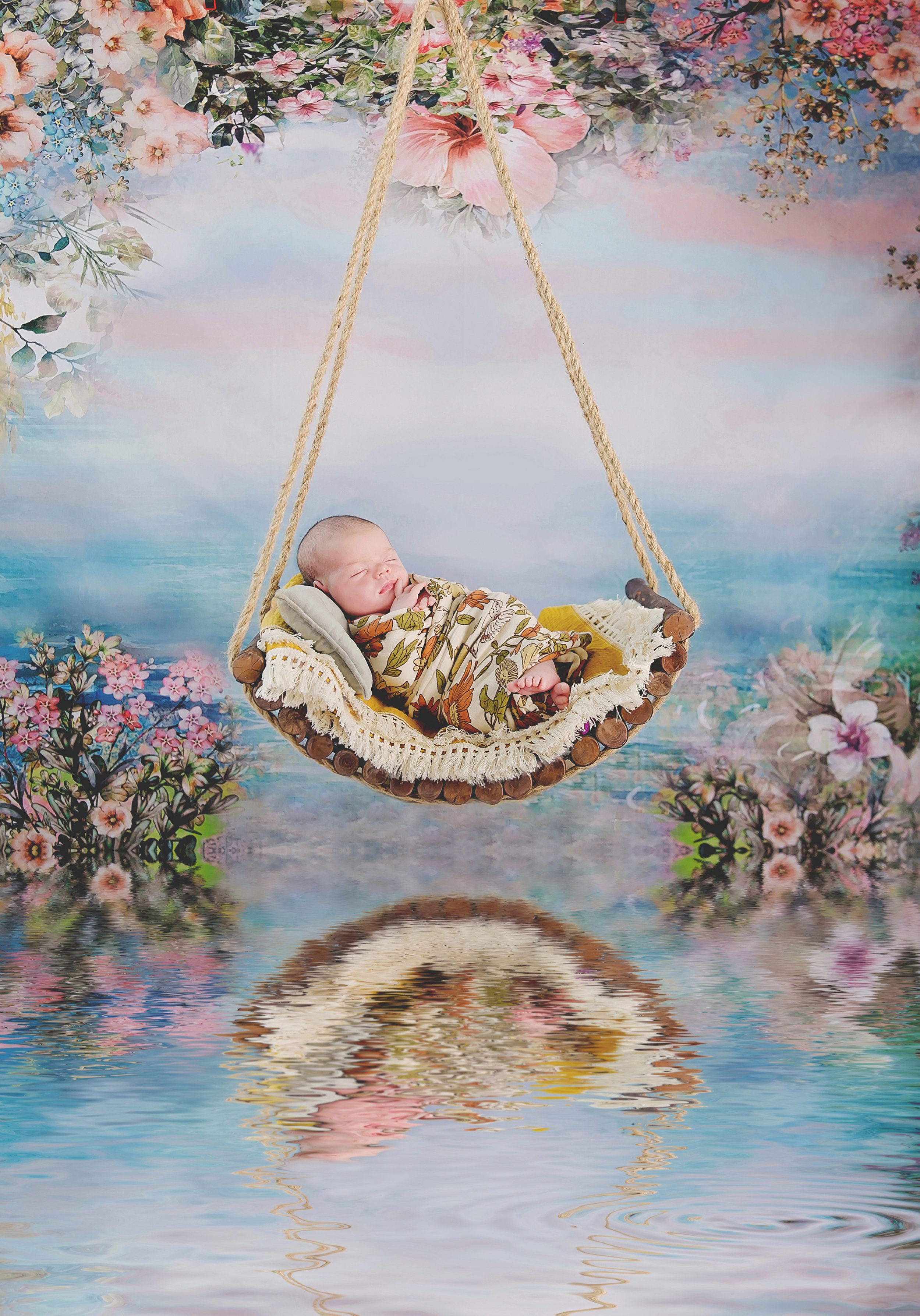 Portrait of a newborn baby in a swing