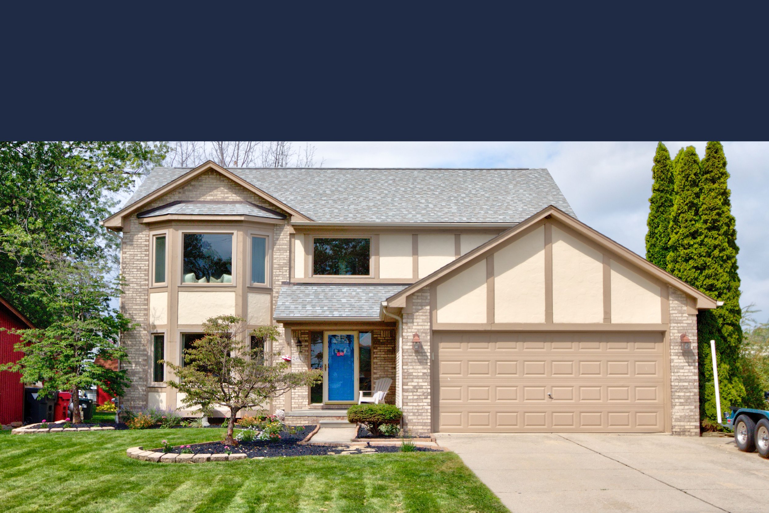Nice Two Story Home With Brick Accents And A Landscaped Yard