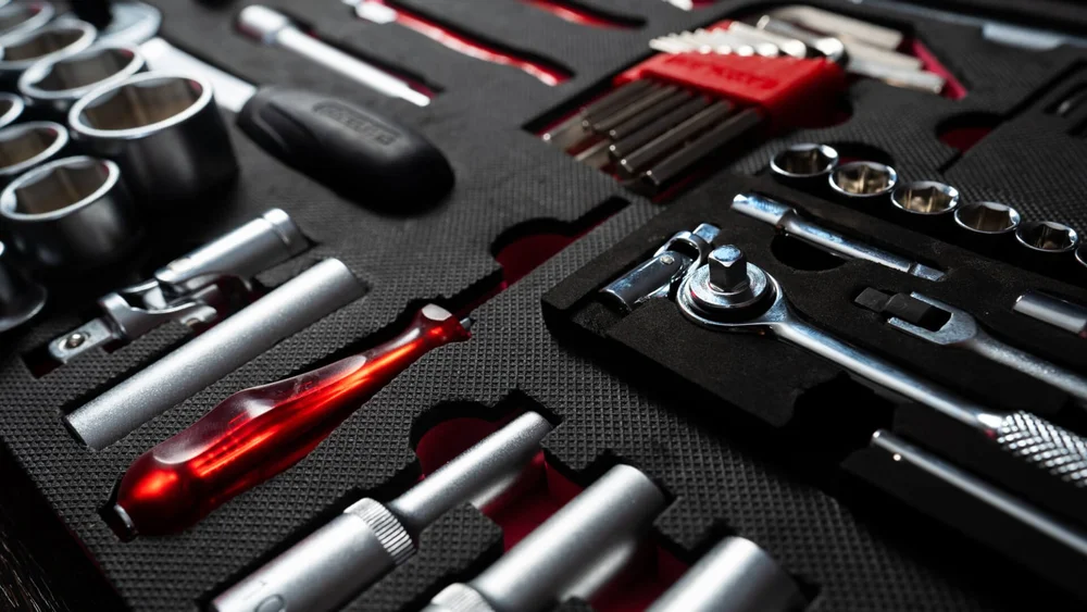 Milking plant service tools laid out in cut foam in an engineer's tray