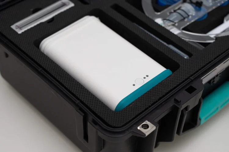 A parasite testing reader sitting in its foam-lined case