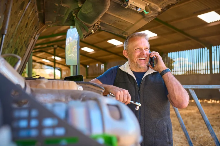 McCaskie field sales representative on farm with a farmer