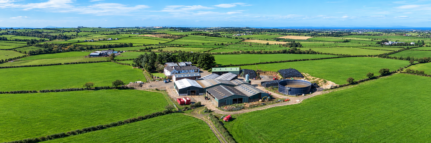 Aerial panorama of Barneighthill Farm, Mauchline: the steading and sheds among green fields in Ayrshire