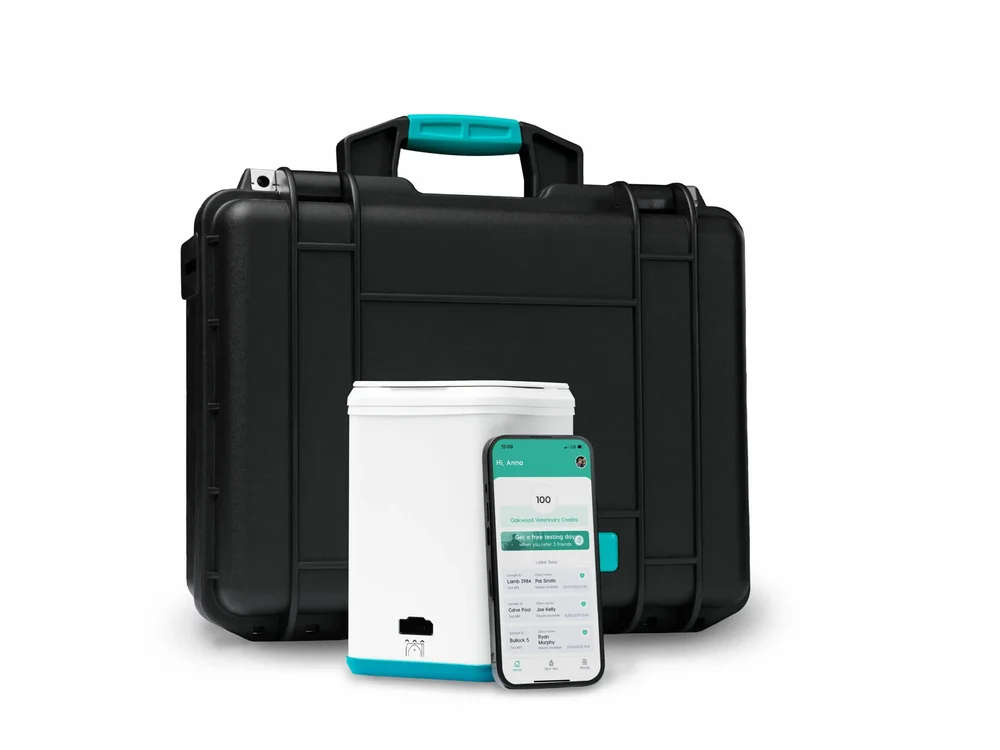 A Micron Kit in its black case standing open beside a smartphone showing the testing app