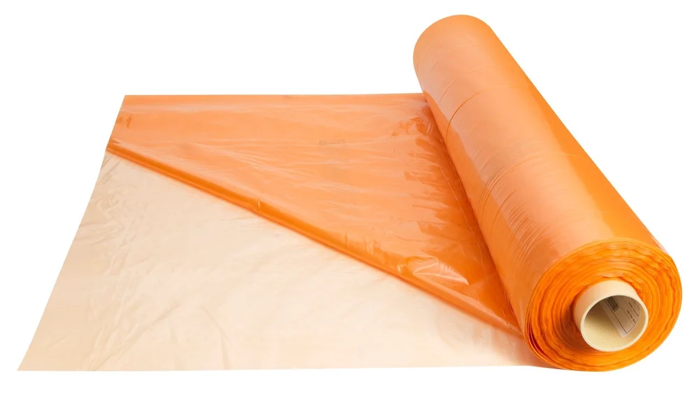 Roll of Silostop Orange oxygen barrier silage film, part unrolled