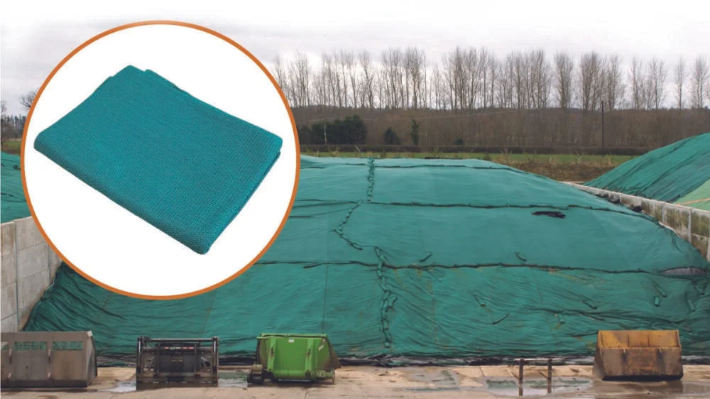 Silage clamp sheeted and covered with a green Secure Cover held down along the shoulders