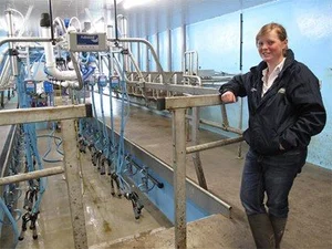 Louise Kennedy of Grougfoot Farm standing in the farm's Fullwood milking parlour