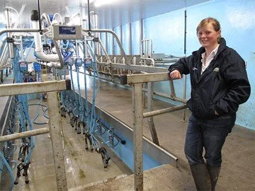 Louise Kennedy of Grougfoot Farm standing in the farm's Fullwood milking parlour