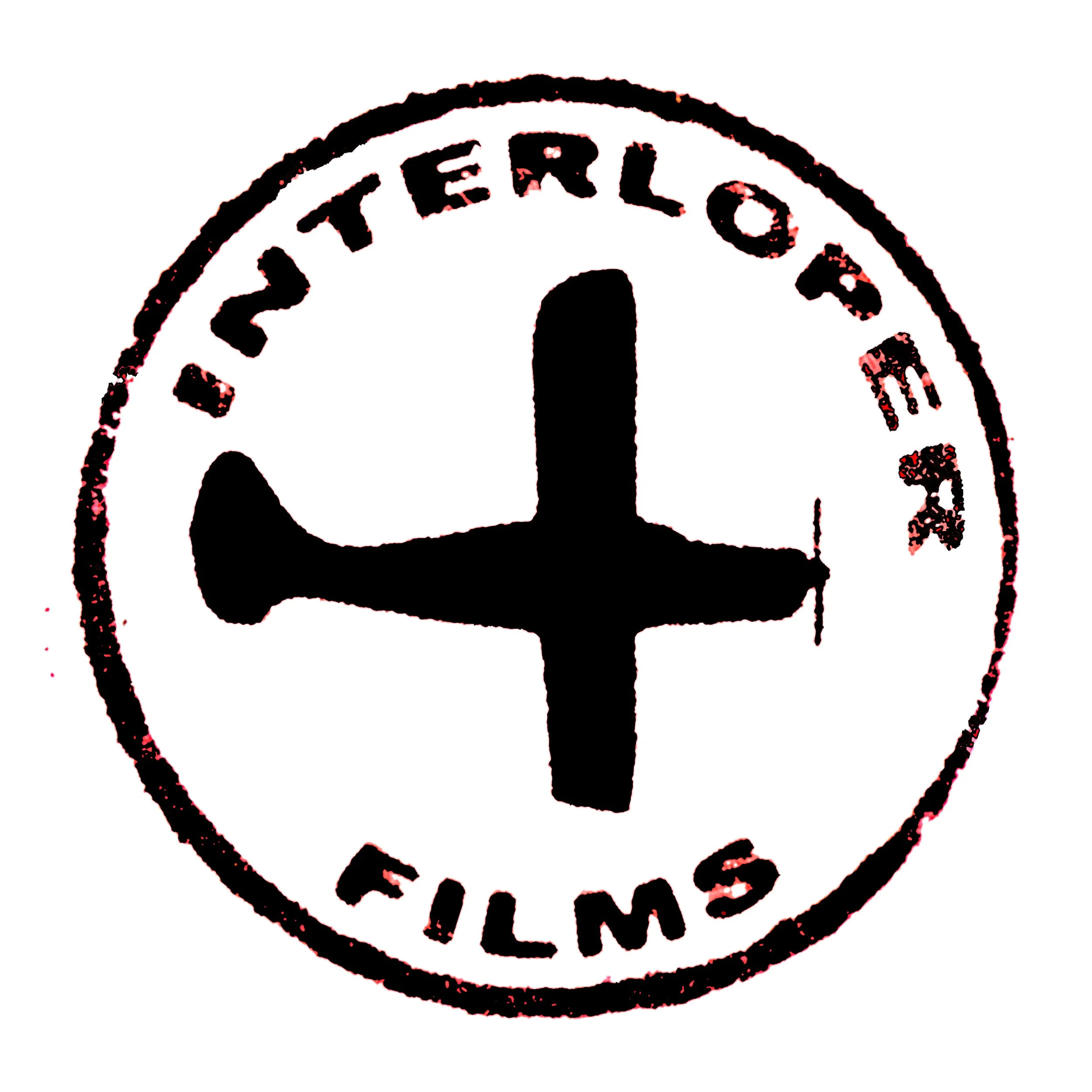 A circular stamp with a black airplane silhouette in the center, surrounded by the text 'INTERLOPE FILMS' at the top and bottom.