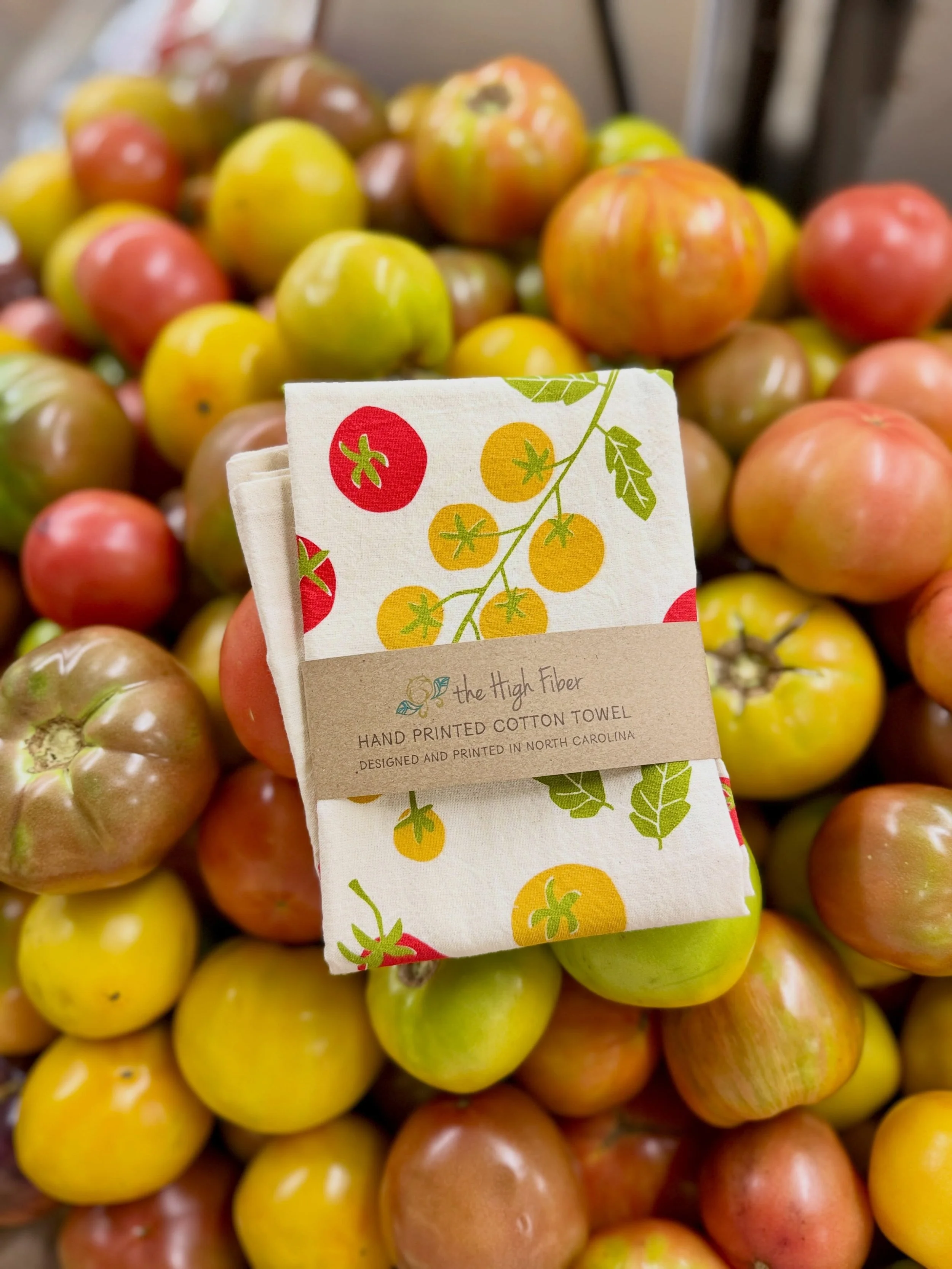 Commemorate the best tomatoes ever with an adorable tomato hand towel! Made by local artist @thehighfiber . We could almost eat them they&rsquo;re so cute.