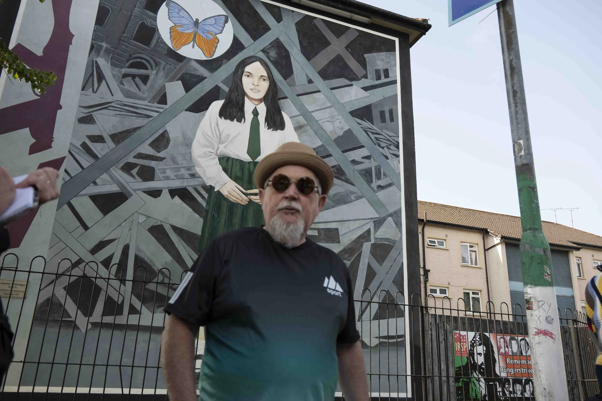 Bogside muralist Tom Kelly with "Death of Innocence," depicting 14 year old Annette McGavigan, who was killed in 1971