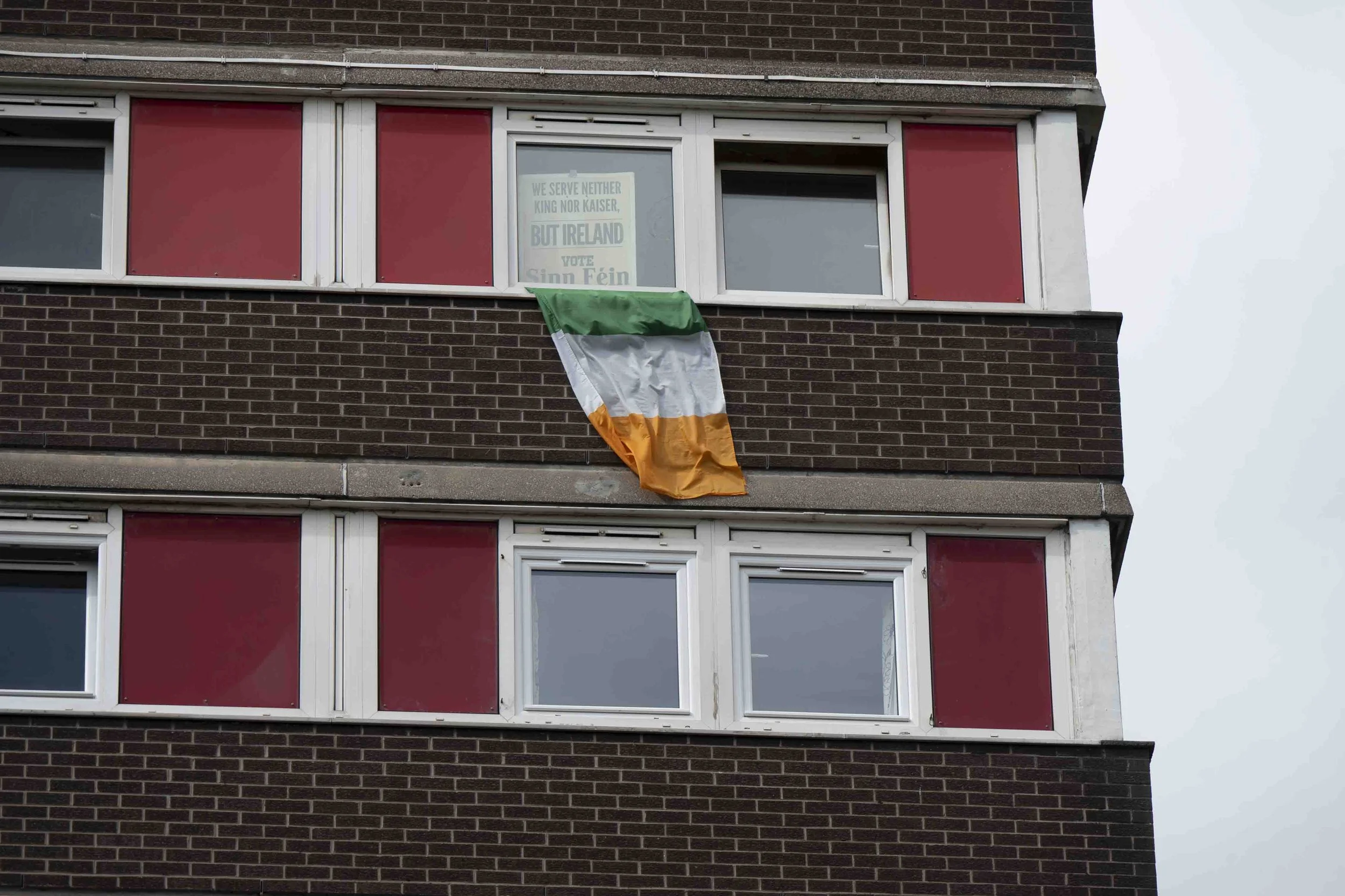 Divis Tower apartment displaying Irish tricolor flag
