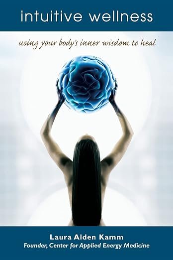 Book cover - image of a woman standing with the back waist up to the camera, nude, with thick black straight hair covering most of her back. She's holding up a blue ball that is textured like a quilt.