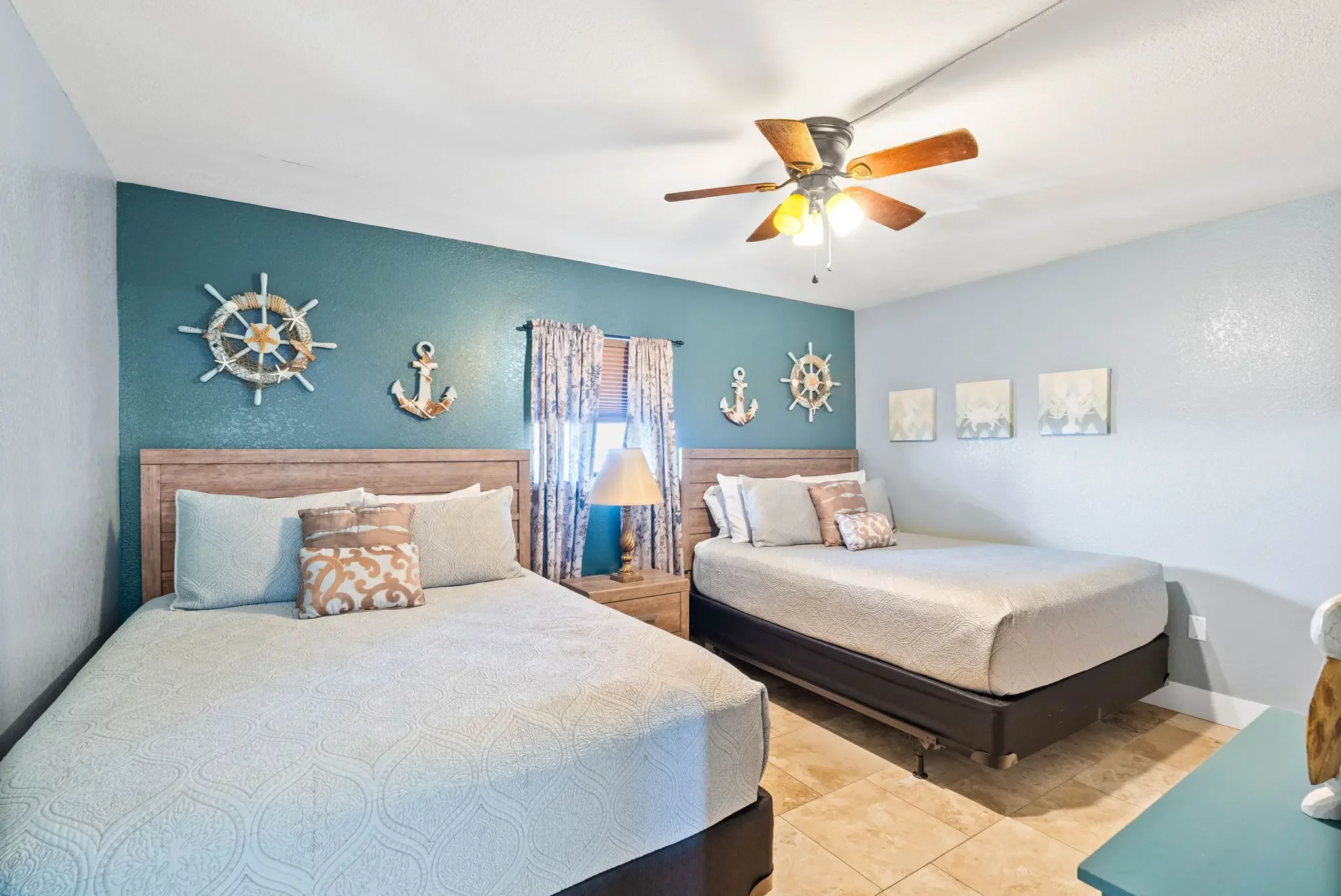 King bedroom with flat-screen TV and coastal décor – Grandview Laguna Reef Rockport