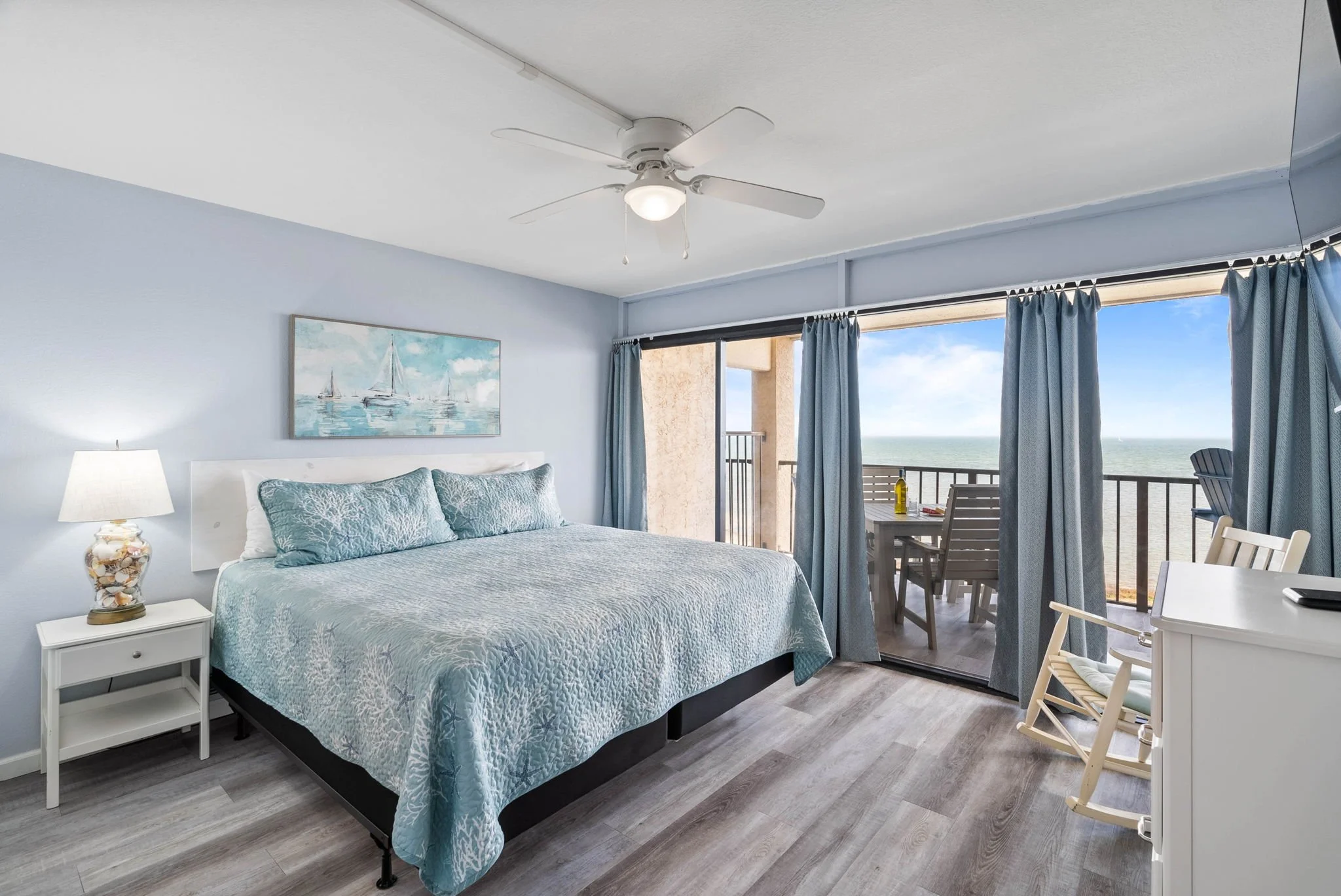 King bedroom with private balcony and bay views at Dayspring Unit 402, Laguna Reef Rockport TX