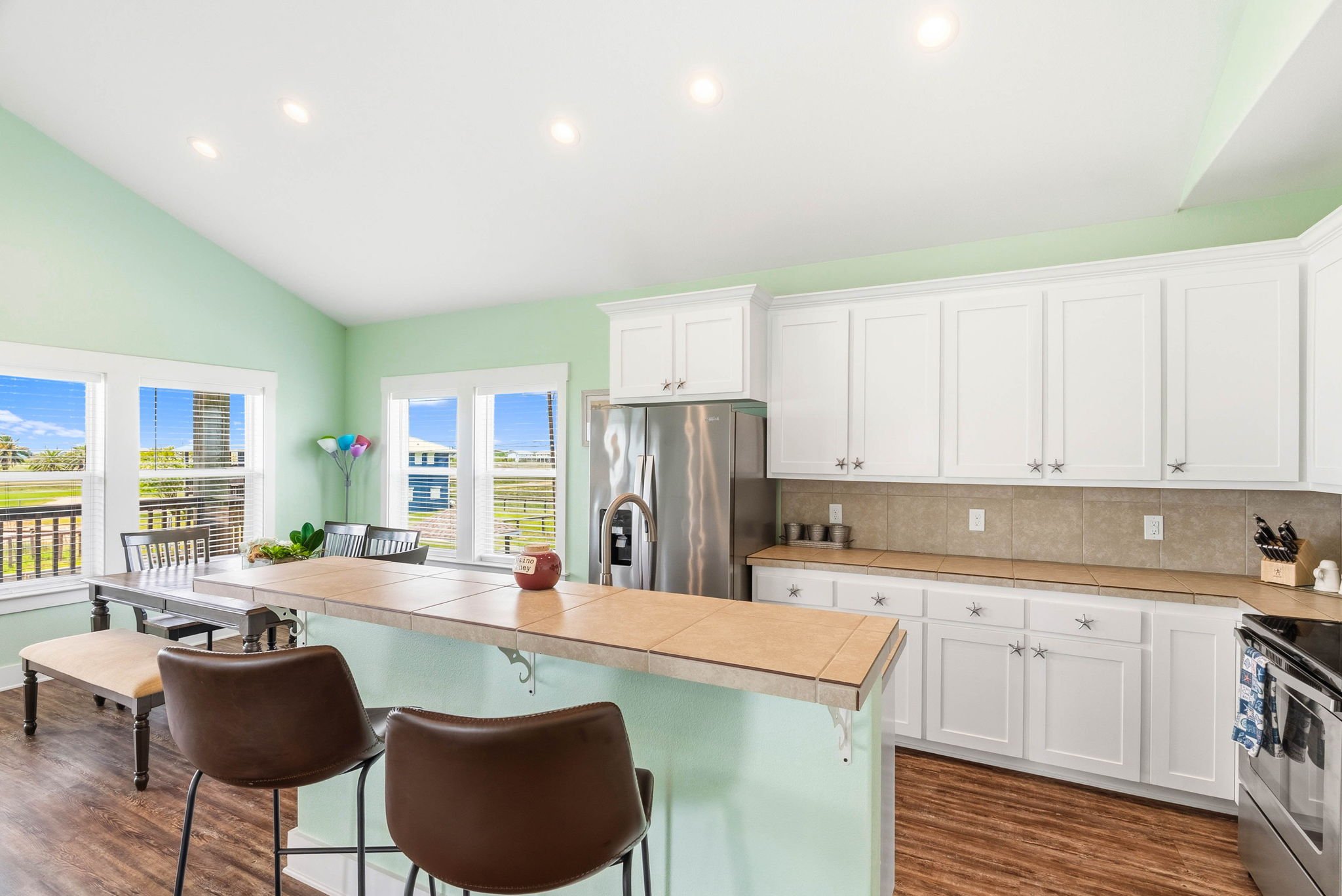 Open kitchen and dining area with breakfast bar at Castaway Cottage near Rockport TX.