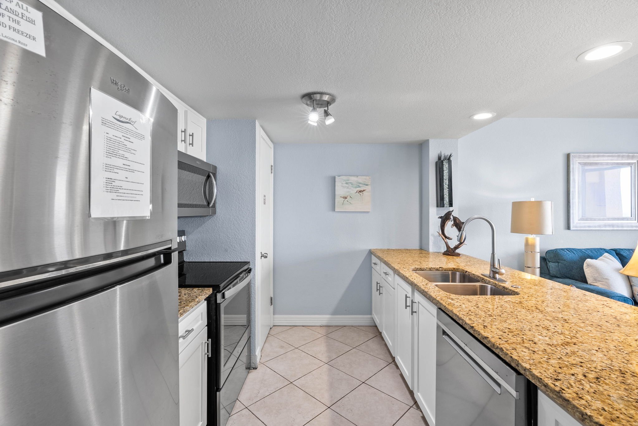 Modern kitchen with granite counters and stainless appliances in Tradewinds 305 at Laguna Reef Rockport TX