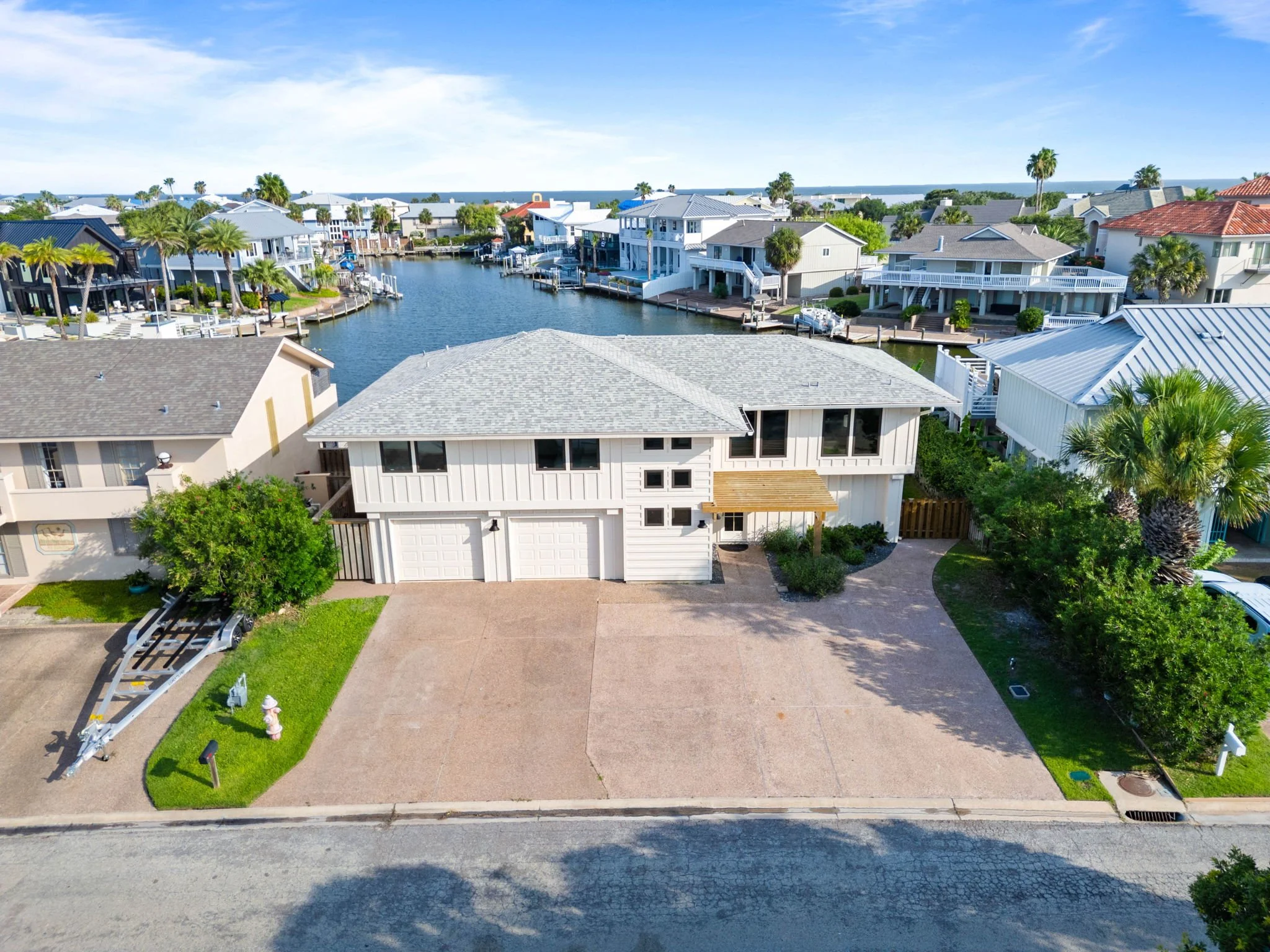 Aerial view of George's Landing waterfront vacation rental on Key Allegro with canal access near Aransas Bay