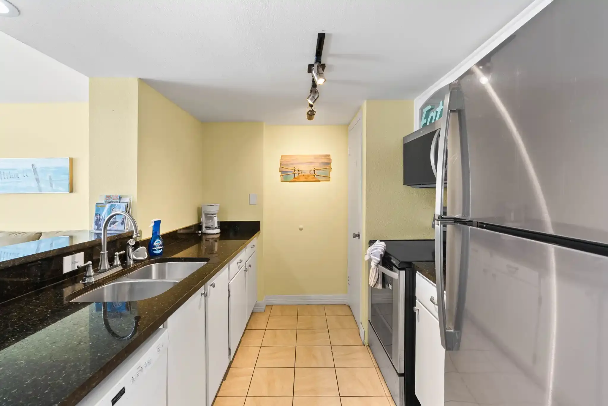 Fully equipped Rockport TX vacation rental kitchen with granite counters, stainless appliances and an open layout for easy stays.